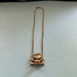 Vintage Avon Girl on Swing Gold Tone 13.5 inch Necklace